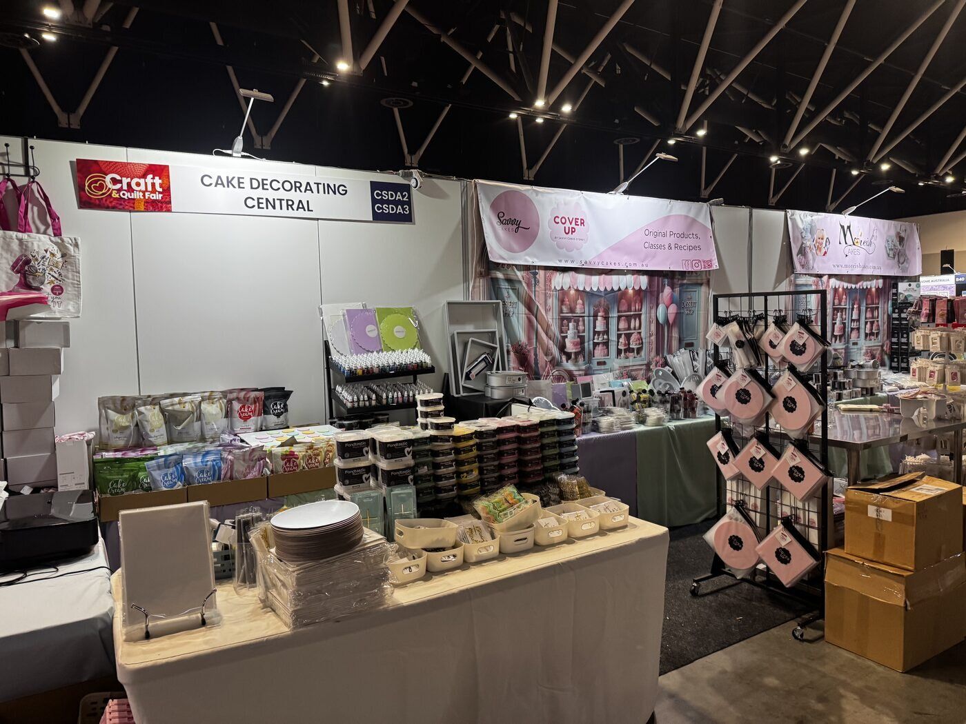 The Cake Decorating Central stand stocked with tools and supplies