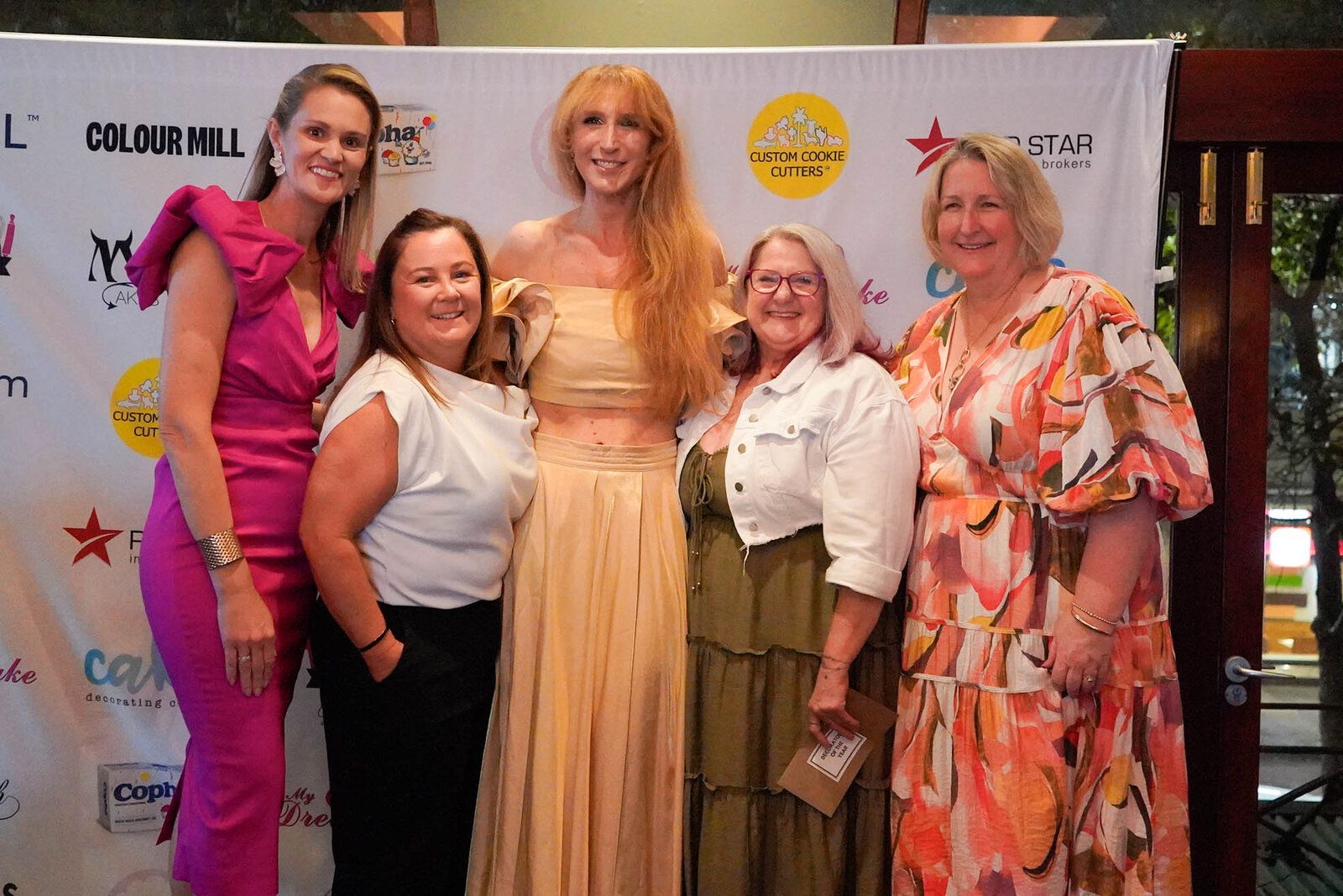 A group of five members posing together at the 2025 community night