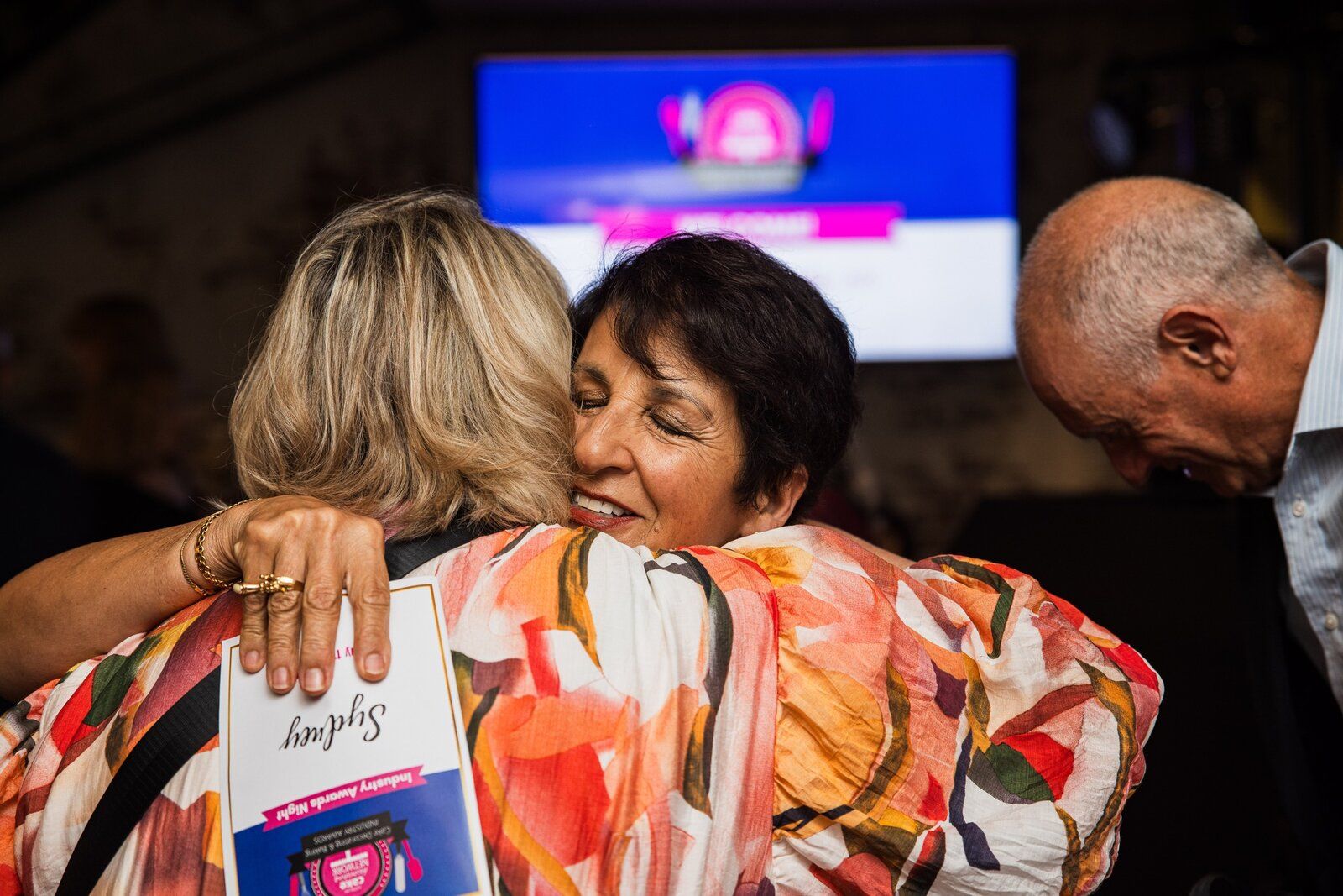 A member being welcomed on stage at the 2025 ACDN awards