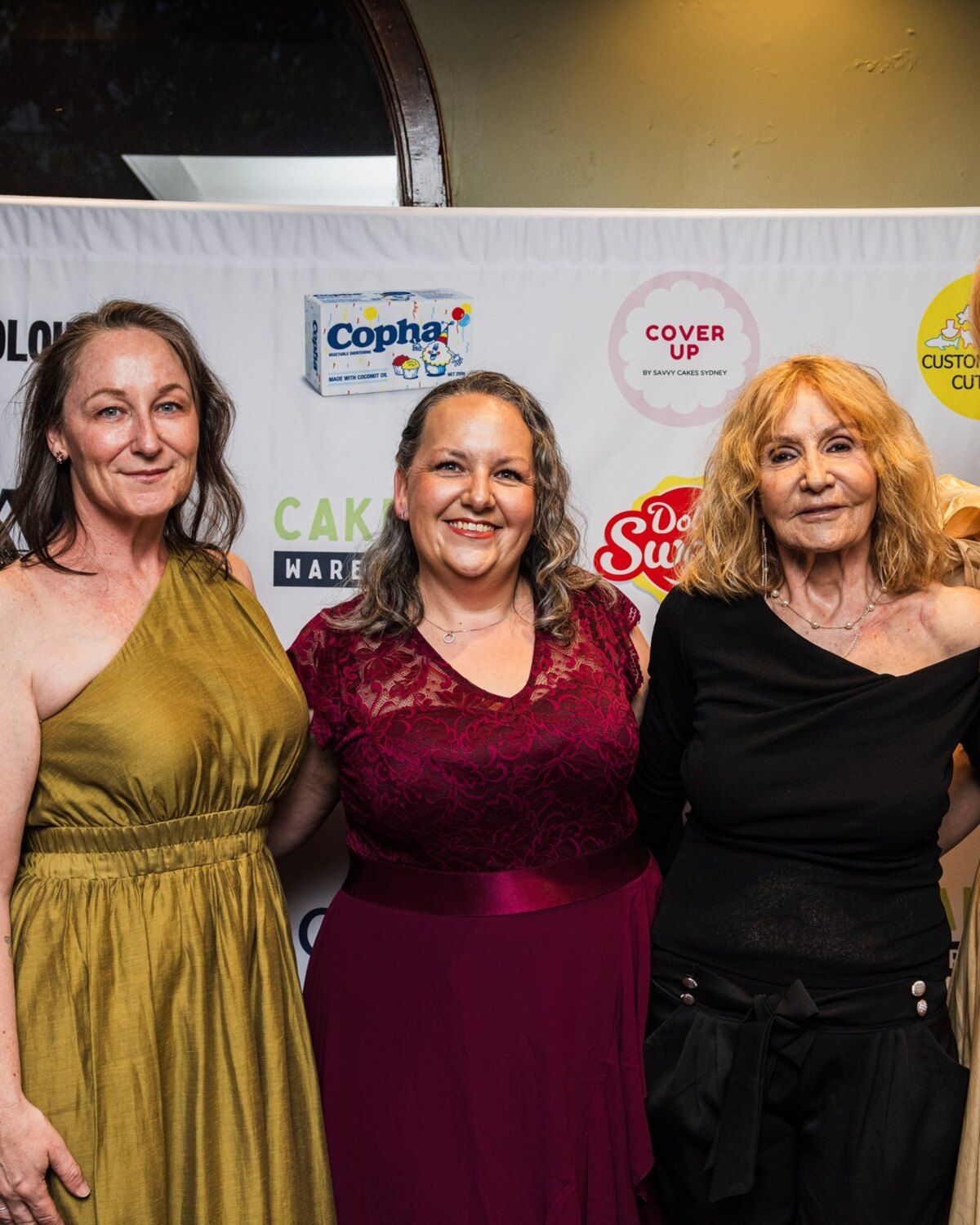 Three members dressed up for the 2025 Cake! Network Awards Night