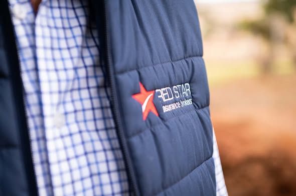 Close-up of a Red Star Insurance Brokers branded vest.