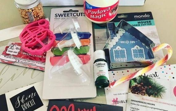 A past Baking Box, the Christmas edition, opened to show its tools and products